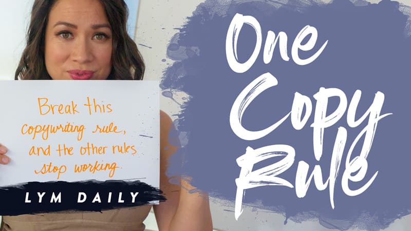 A woman holds a sign that reads, Break this copywriting rule, and the other rules stop working. The background includes large text that says, One Copy Rule, with LYM Daily written below.