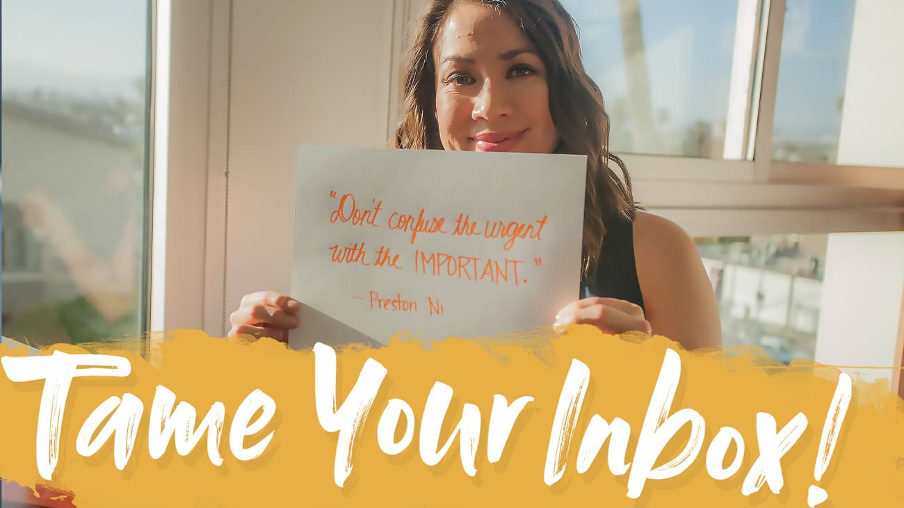 A woman holds a sign with the quote Dont confuse the urgent with the important. - Preston Ni written on it. Bold text below reads Tame Your Inbox! The background shows a sunny indoor setting.