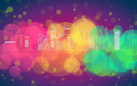 Colorful abstract city skyline with skyscrapers outlined against a vibrant background of multicolored circles and bokeh effects. The gradient features shades of purple, pink, yellow, green, and orange, creating a lively and dynamic scene.