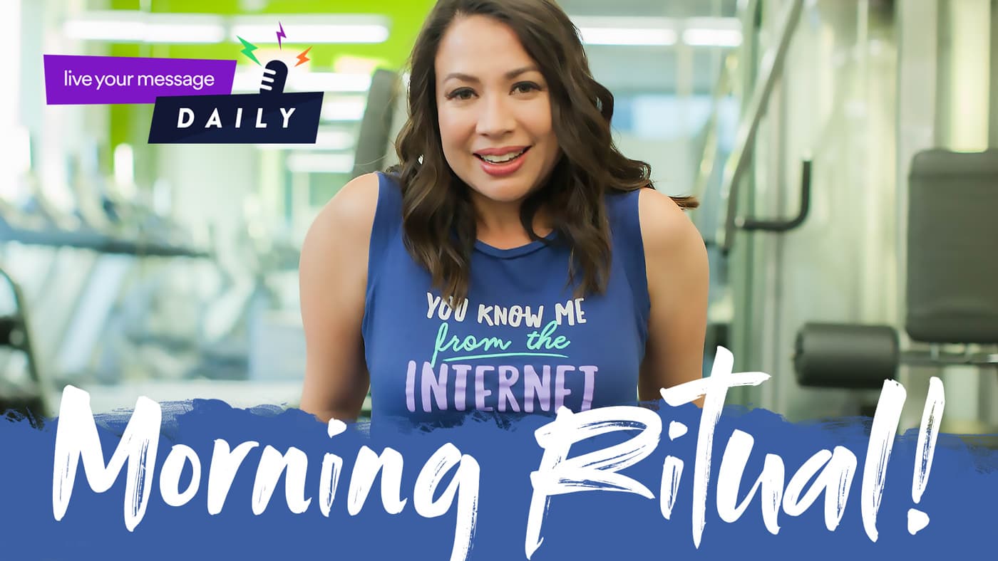 A woman smiles in a gym wearing a blue shirt with the text, You know me from the Internet. The image features graphics with live your message DAILY and Morning Ritual! in bold letters. Fitness equipment is visible in the background.