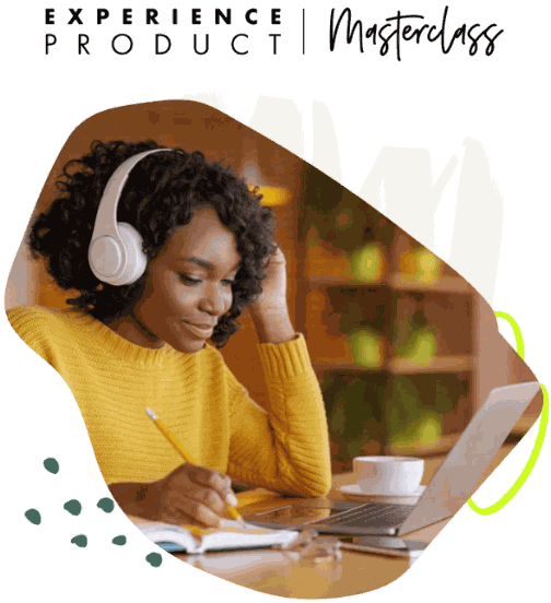 A woman with headphones works on a laptop