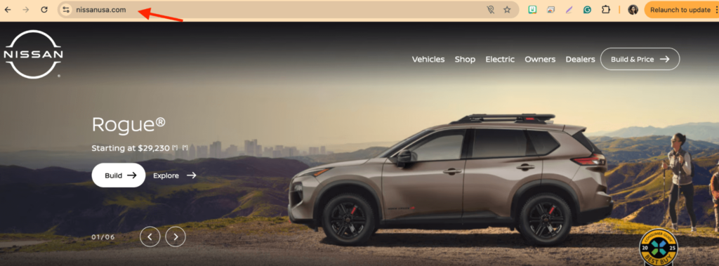 A Nissan Rogue SUV parked on a scenic overlook with mountains in the background. The webpage header includes a navigation menu with options like Vehicles, Build & Price, and more. An update notification is visible on the browser tab.